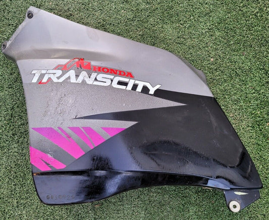 Cache plastique côté gauche 125 Honda transcity NX 1997