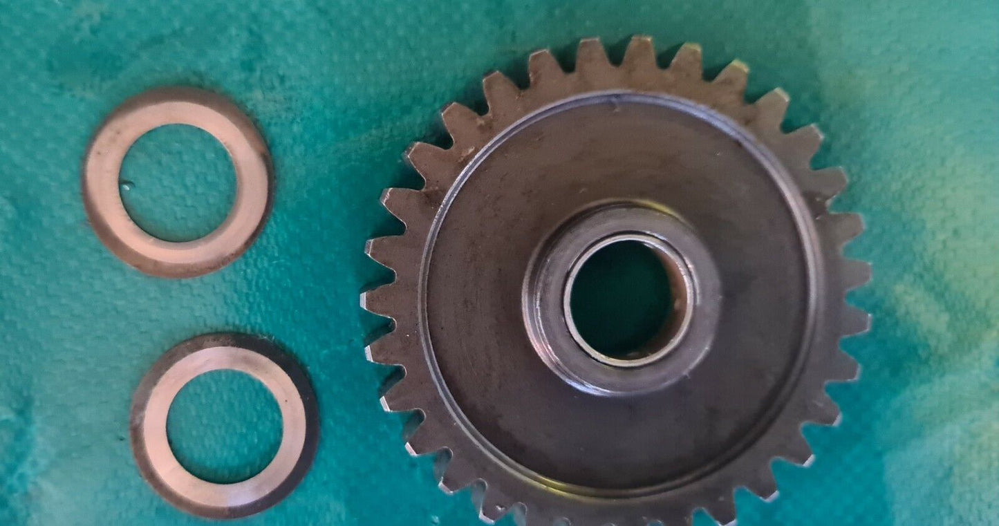 Engrenage entre  rocher de kick et cloche d'embrayage 125 kx Kawasaki 1987